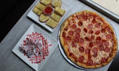 Pizza, breadsticks, and dessert from Al's pizza
