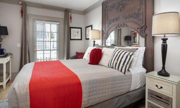 One guestroom in this bed and breakfast has a white and grey decor with red highlights