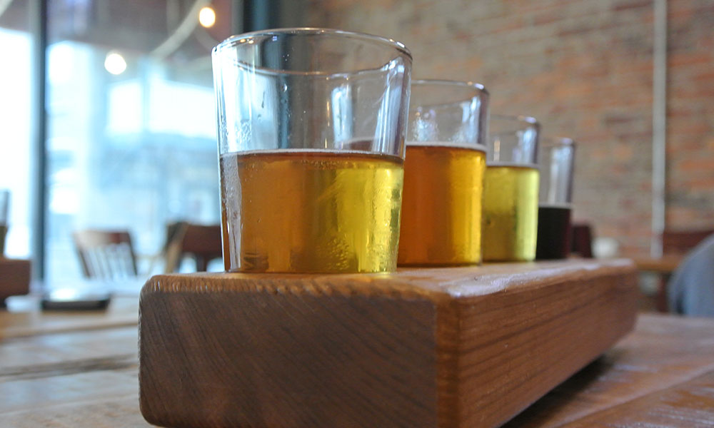 Sample Bog Brewing Company's local brews in a tasting flight. 