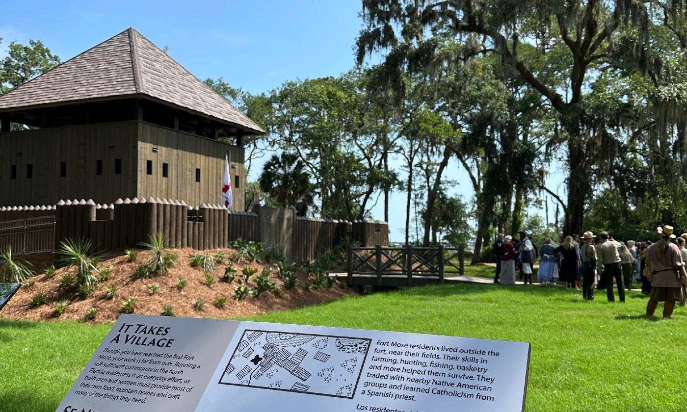 Fort Mose viewed beyond a sign describing the location