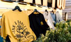 Ink & Barley branded t-shirts on display