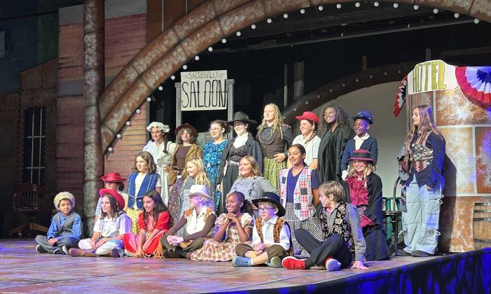 A group of children performing on stage