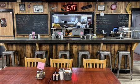 The counter space with the kitchen in the back