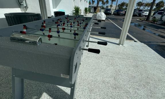 A foosball game on a deck at Ocean Sands Inn