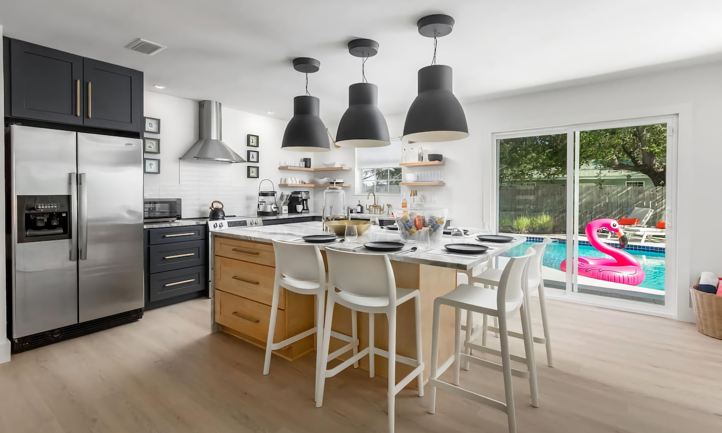 A vacation rental on Anastsia Island has a modern eat-in kitchen right off the pool deck