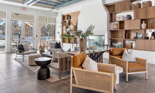 The common lounge at Soluna Apartments has multiple seating spaces