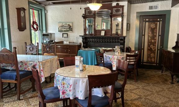 A dining area in an old inn in St. Augustine, with tables of various shapes and sizes